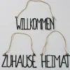 Schild Schriftzug WILLKOMMEN